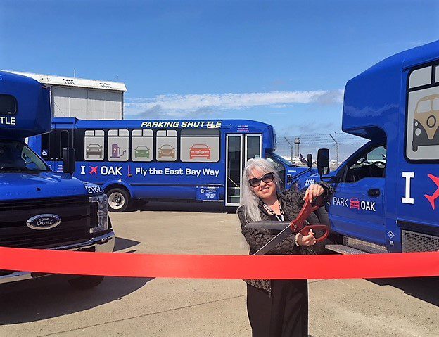 Alma Pena Cuts Ribbon on Blue Shuttles
