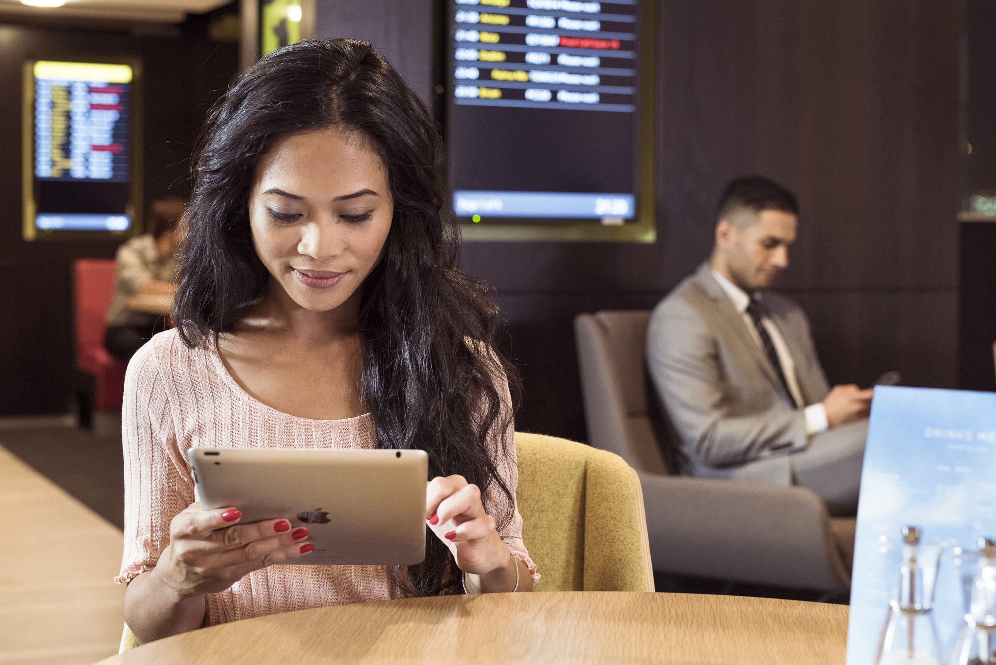Woman with Ipad at Countertop