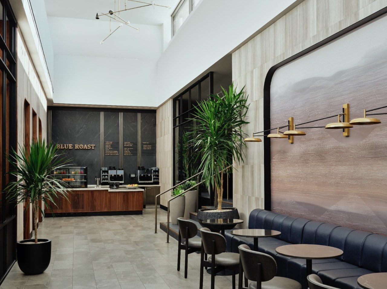 Blue Roast Cafe at the American Express Centurion Lounge at Salt Lake City International airport. A full-service coffee bar and banquette seating with tables for two are pictured.