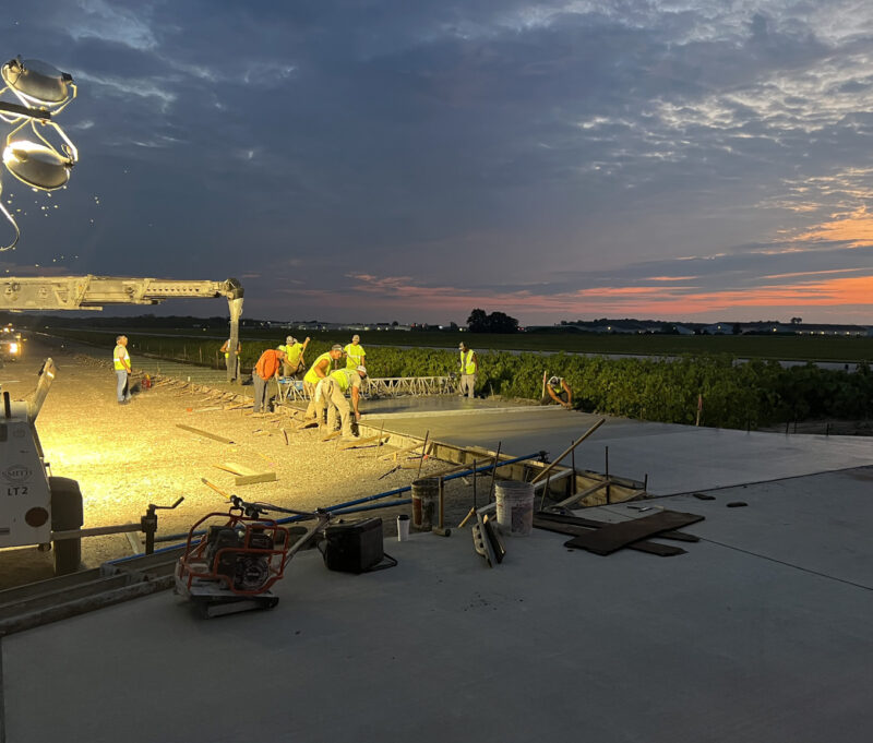 Paving crews started work at 4:00 a.m. to help trucks delivering wet concrete avoid traffic delays later in the day.