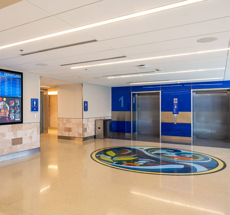 Finish materials and color schemes are consistent with those in the main terminal.