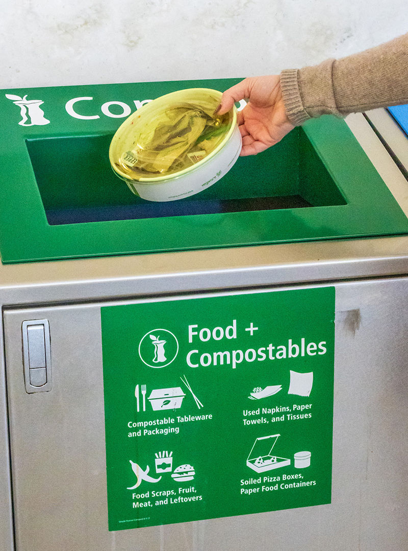 New waste collection stations have separate bins for compost material, recycling and trash.