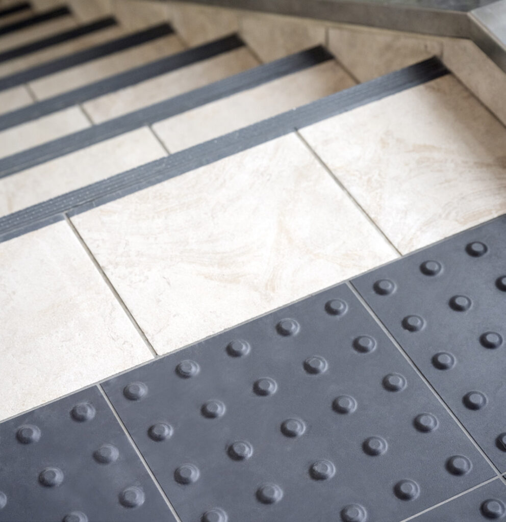 The airport added tactile elements at the top of stairways and contrastingcolors on each step to aid visitors with impaired vision.
